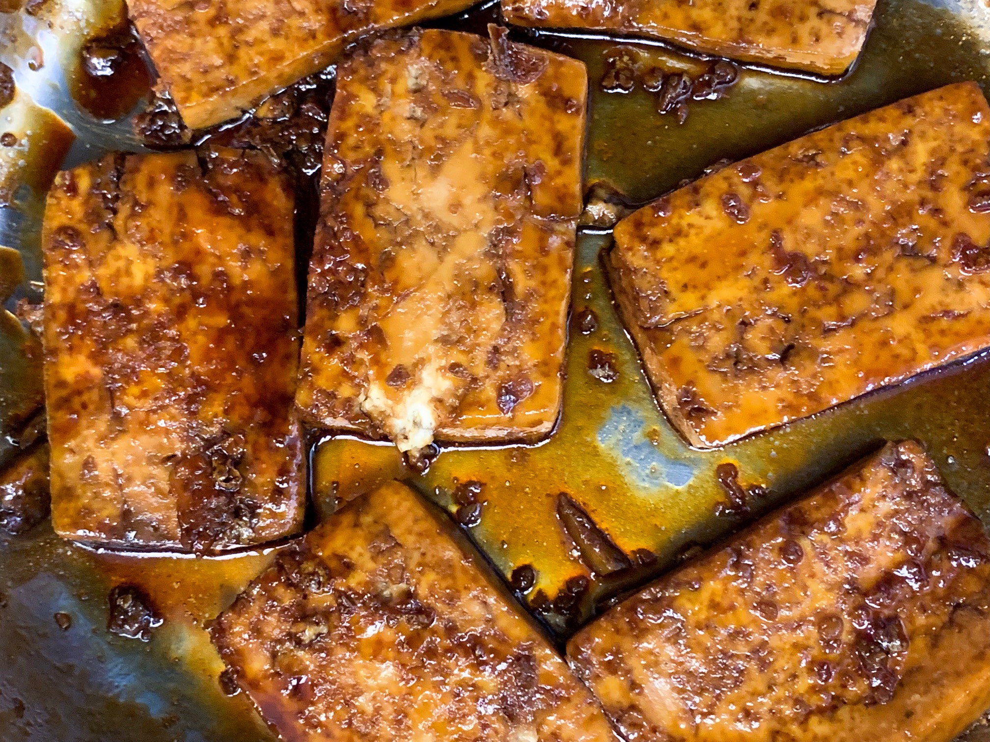 finished sweet and sour tofu in pan with an eggy texture