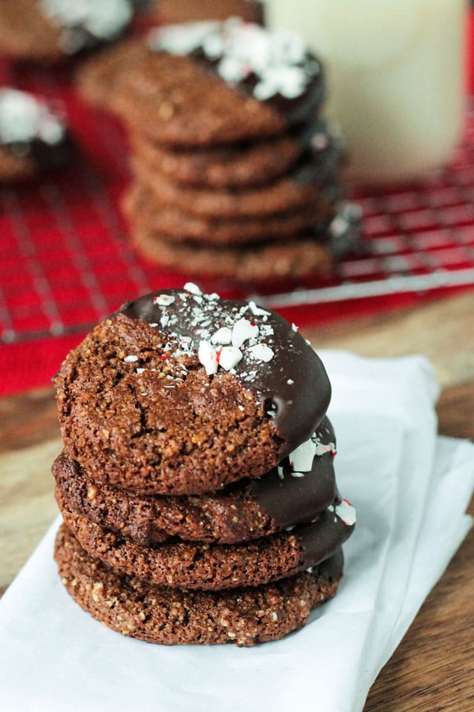 Stack of dark brown Chocolate Gingerbread with one side dipped in chocolate and sprinkled with peppermint pieces