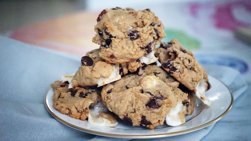 Pile of clumpy S'more flavored vegan christmas cookies on a plate.
