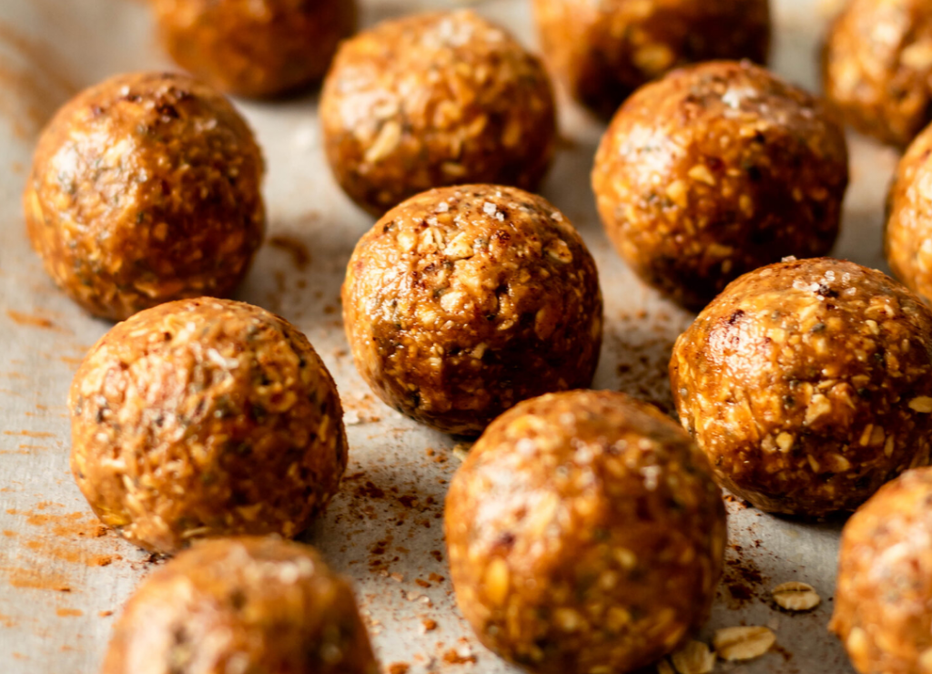 Rows of round, balls of no-bake snickerdoodle cookies for christmas