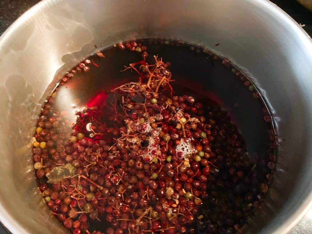 elderberries in pot before boiling