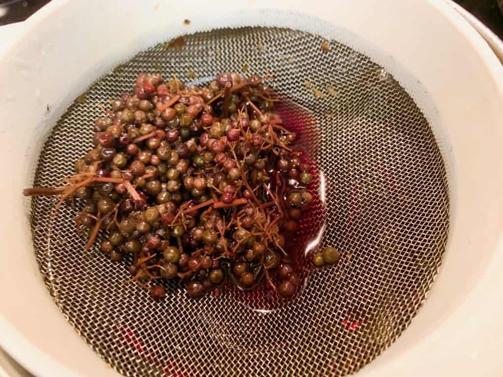 strained elderberries after making syrup