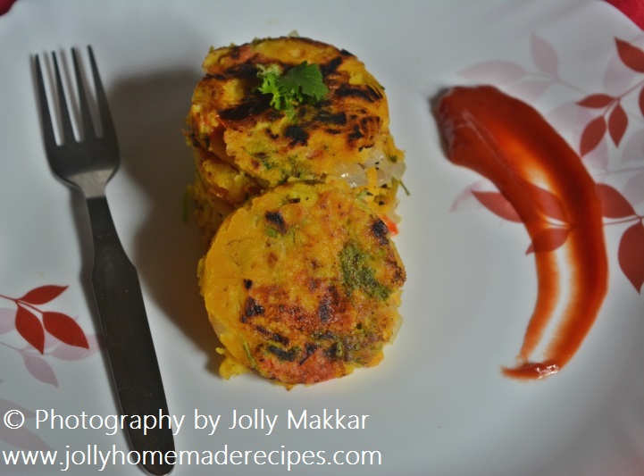 Photo of tomato omelettes stacked on a decorative plate with a parsley garnish.