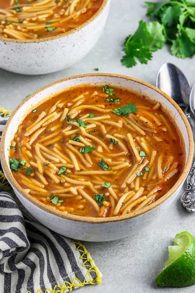 Photo of two bowls of Sopa de Fideo one of the best vegan recipes for kids