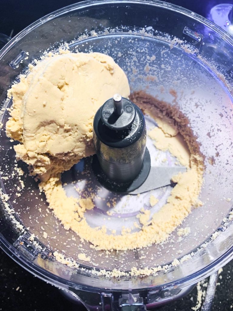 ball of homemade cashew butter in food processor