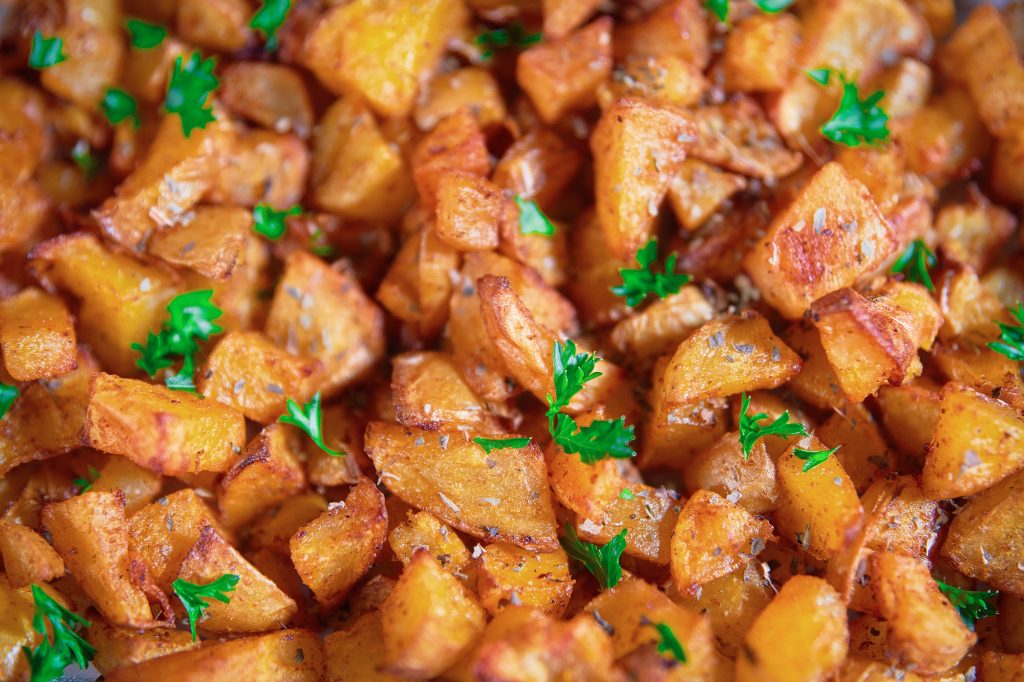 vegan oven roast potatoes close up in a dish
