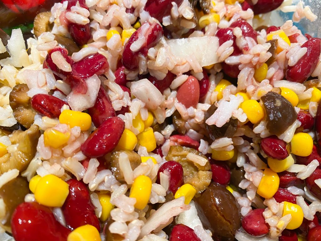 Close up of filling for vegan stuffed peppers with rice, beans, and corn.