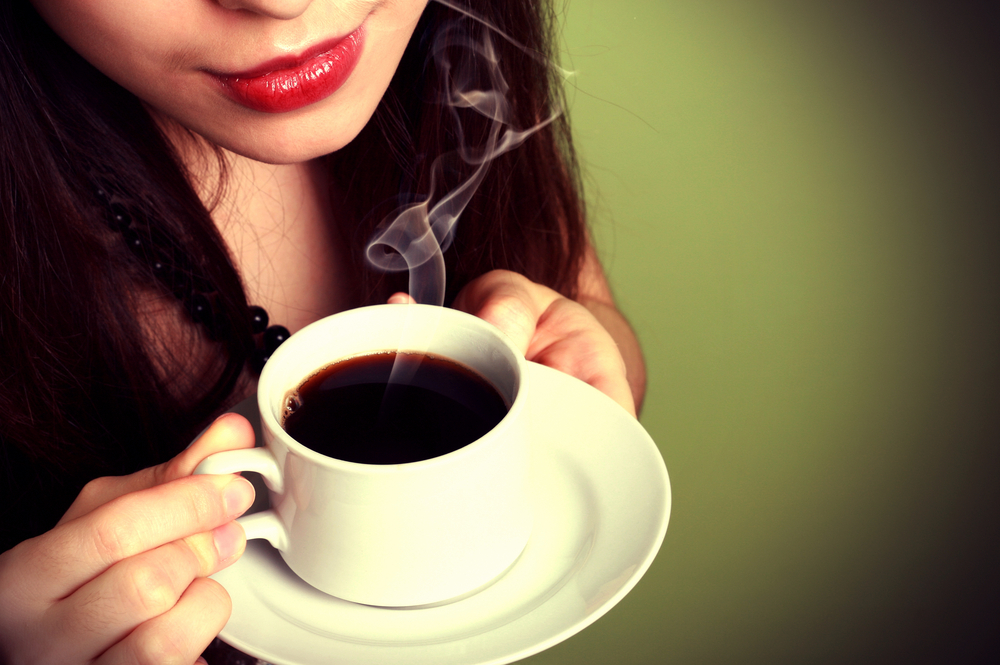Women drinking  a black coffee 
