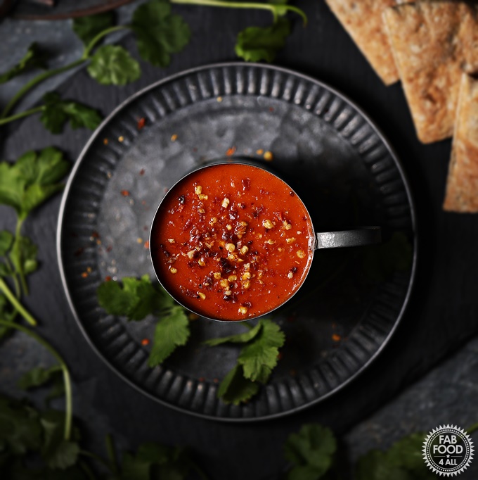 Photo of a cup of vegan tomato soup, a classic among the vegan soup recipes.