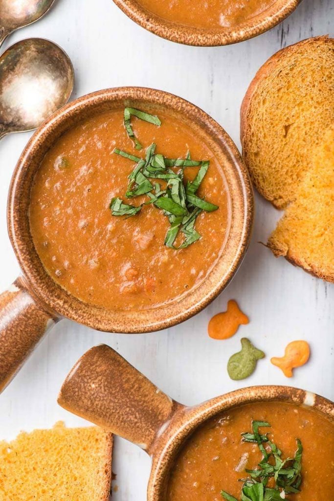 Photo of a tan round bowl serving vegan lentil soup. One of the highest in protein among the vegan soup recipes. 