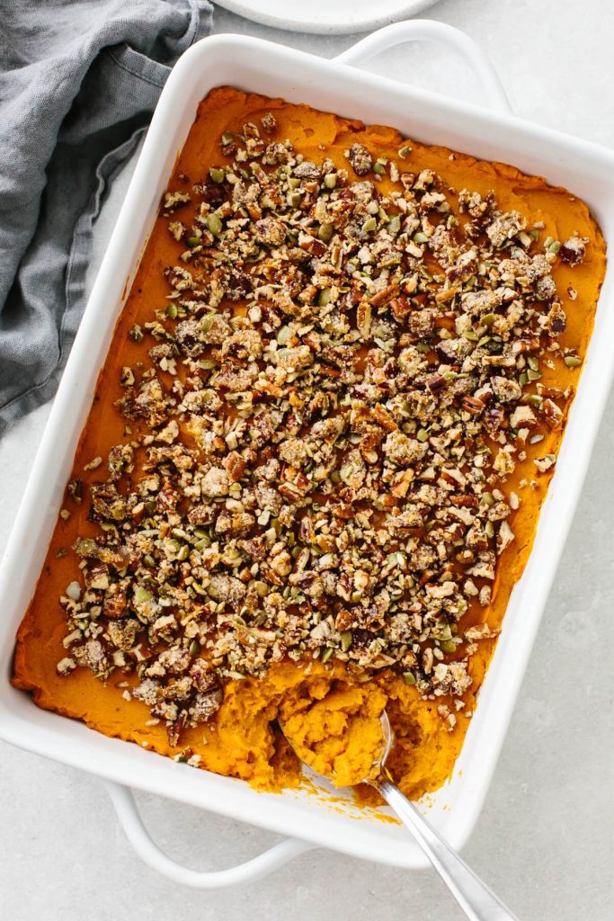 Photo of a large casserole dish serving healthy sweet potato casserole. 