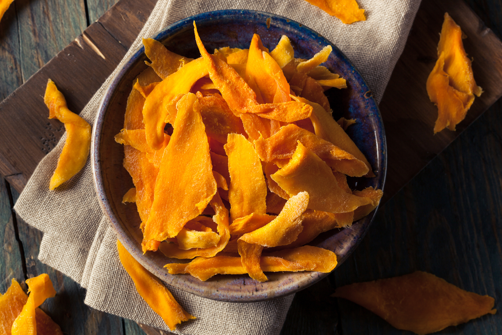 Dehydrated mangoes is one of the many tasty food options you can make in a food dehydrator!