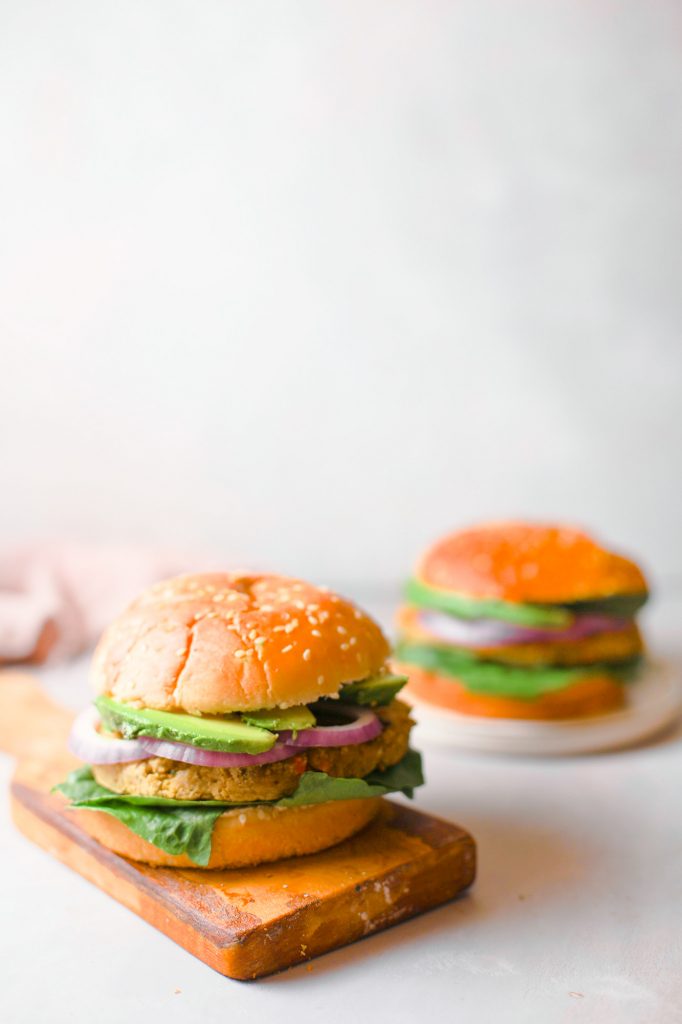 two chickpea veggie burgers on white counter