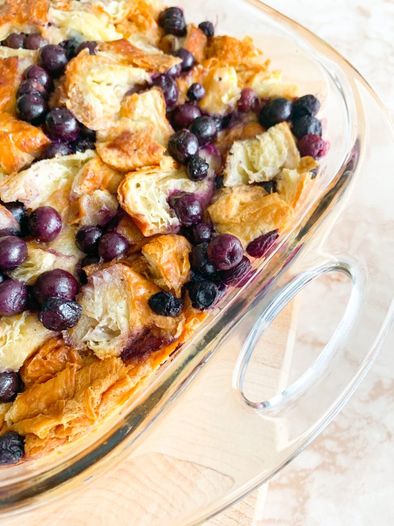 side of blueberry bread pudding with croissants