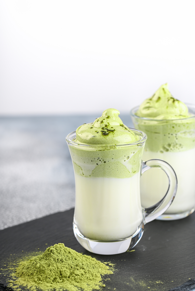 dalgona matcha in pretty cups with matcha poweder