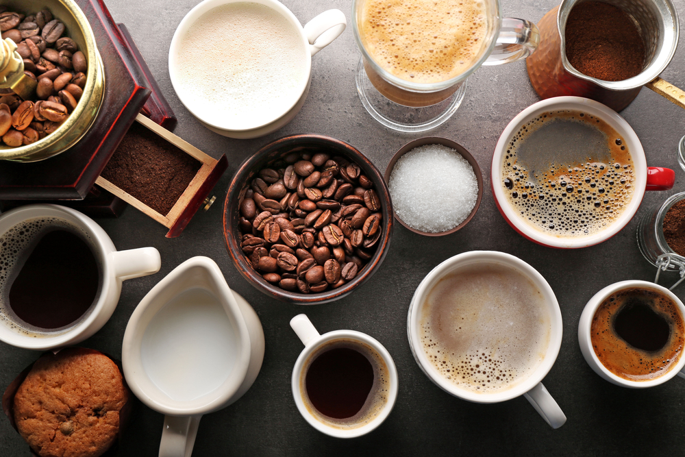 Hot drinks sitting on a table 