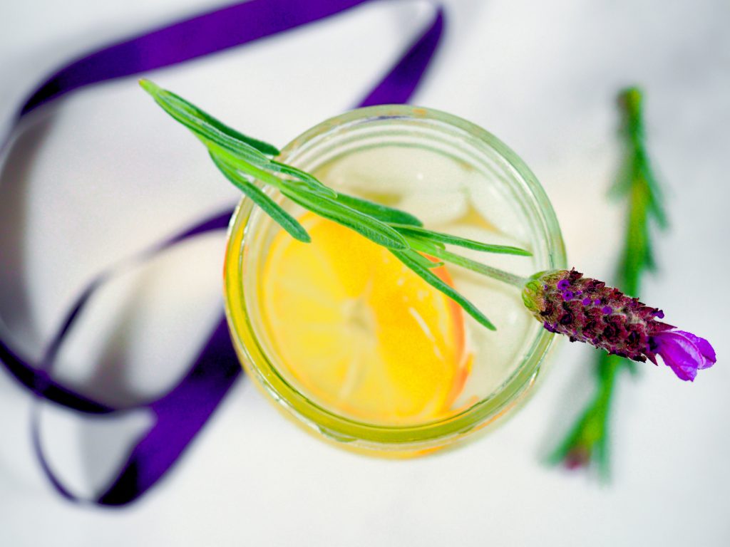 lavender on top of glass of fresh lemonade