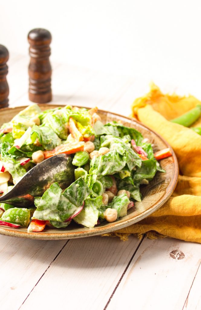 chop salad with maple tahini dressing on it