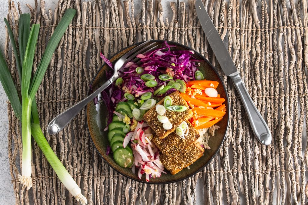 overhead view of sesame tofu on vegan power plate