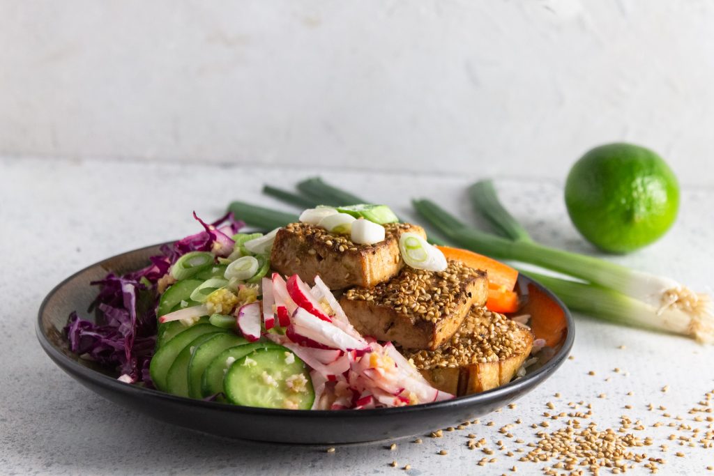 baked sesame tofu power plate on white counter