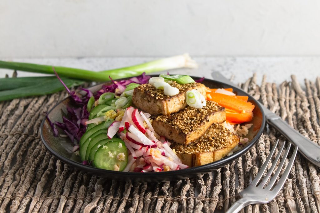 close up of vegan power bowl with sesame tofu
