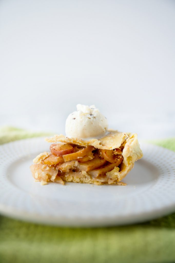 vegan apple pie with vegan ice cream on the slice