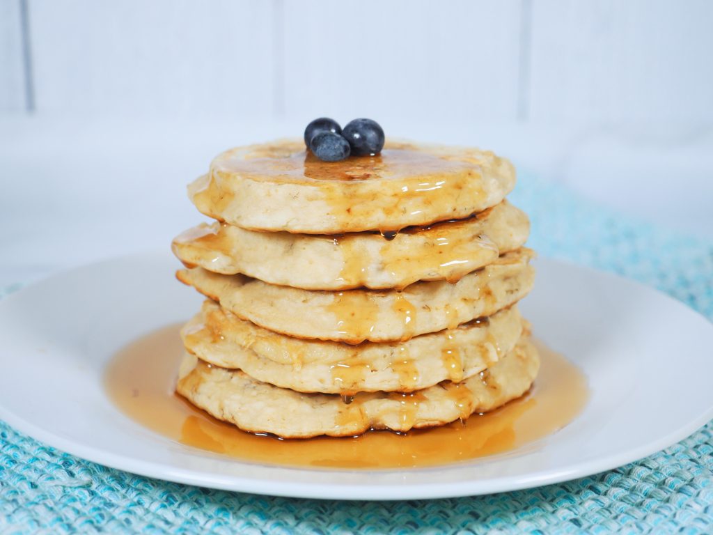easy vegan banana pancakes on plate with syrup