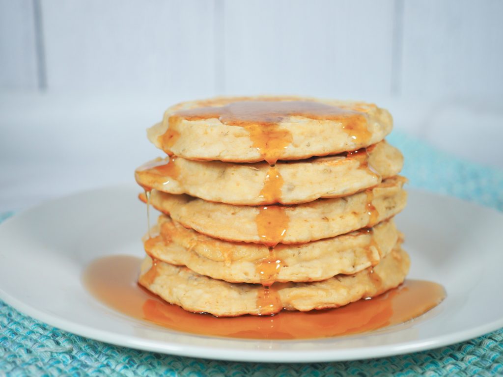vegan banana pancakes with maple syrup on plate