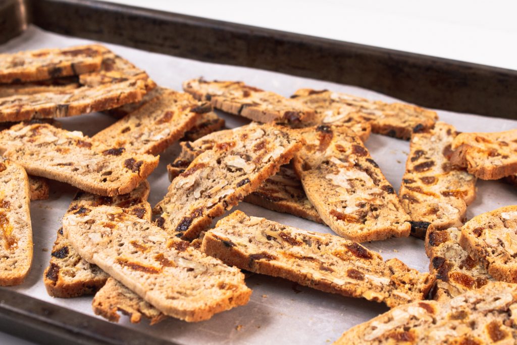 vegan biscotti cookies on tray with greaseproof paper.