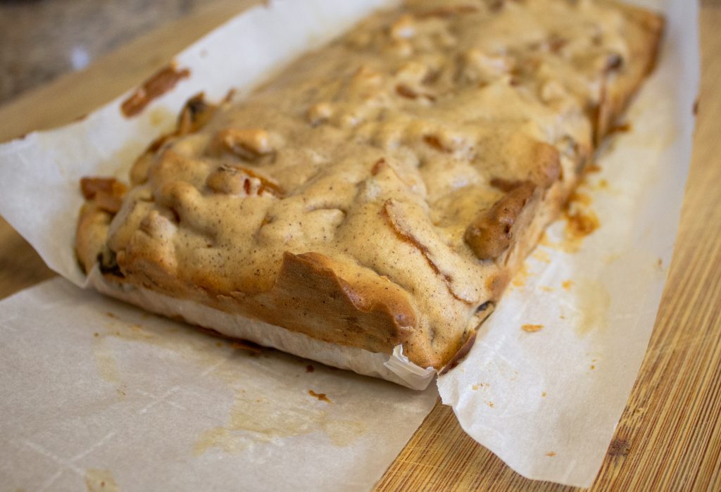 finished loaf out of the oven ready to be cut into vegan biscotti