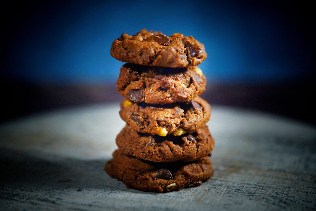 vegan chocolate cookies on blue background