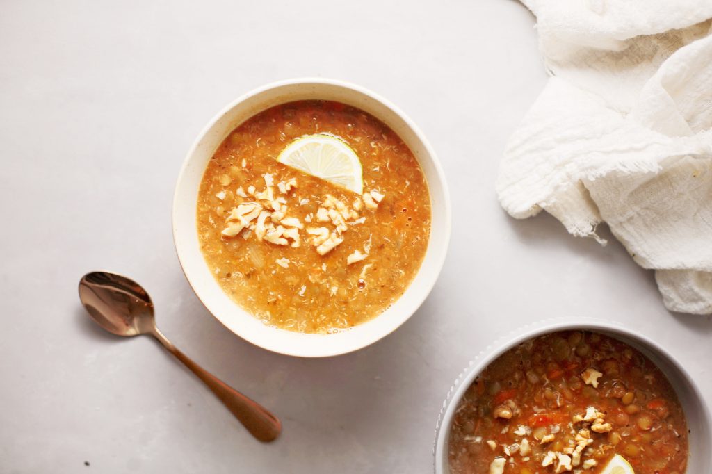 vegan lentil soup in bowl with spoon