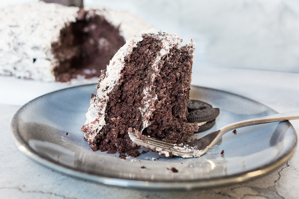 close up of moist chocolate cake with oreo buttercream frosting