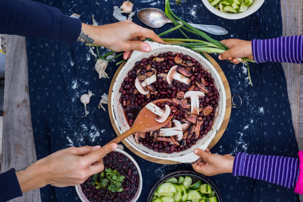 children working on vegan recipe in kitchen