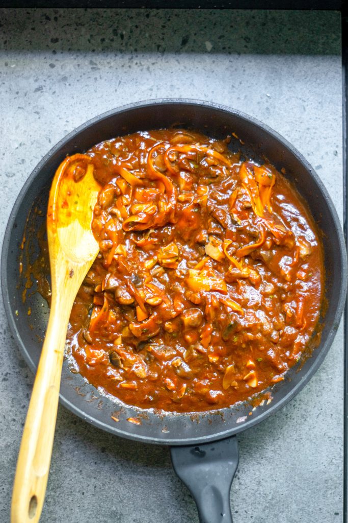 vegan bolognese sauce in pan during cooking