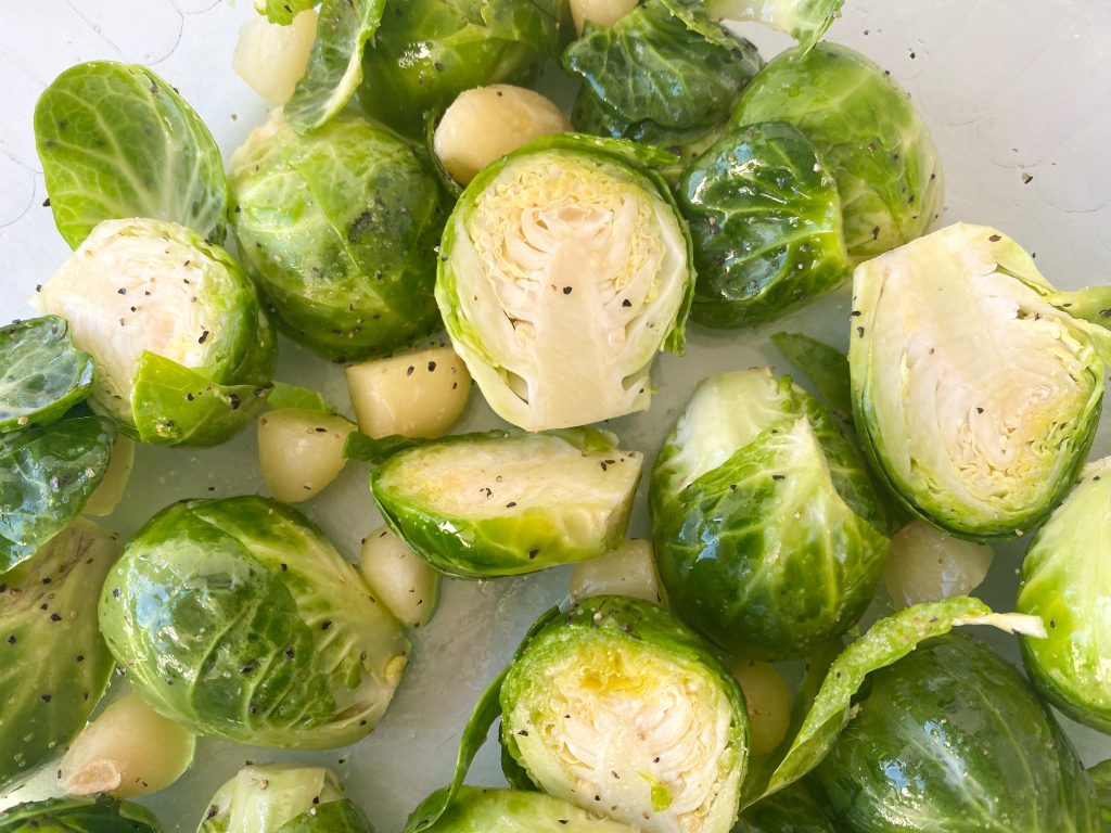 brussels sprouts before being cooked seasoned with garlic