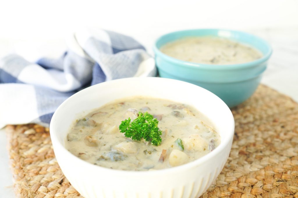 close up of two bowls of vegan clam chowder soup