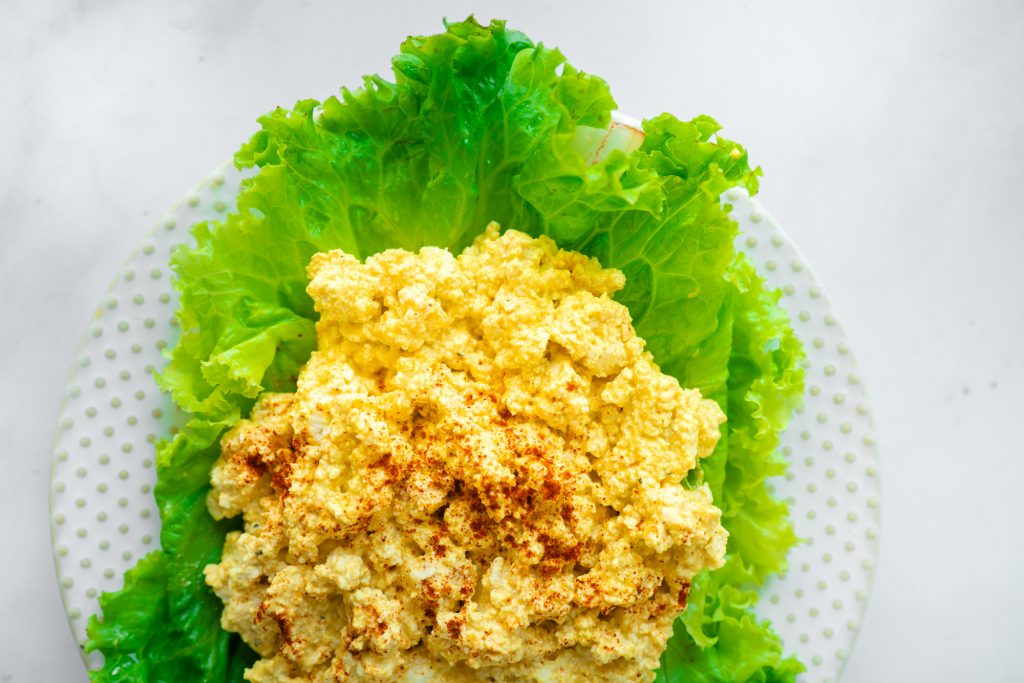 vegan egg salad on bed of lettuce