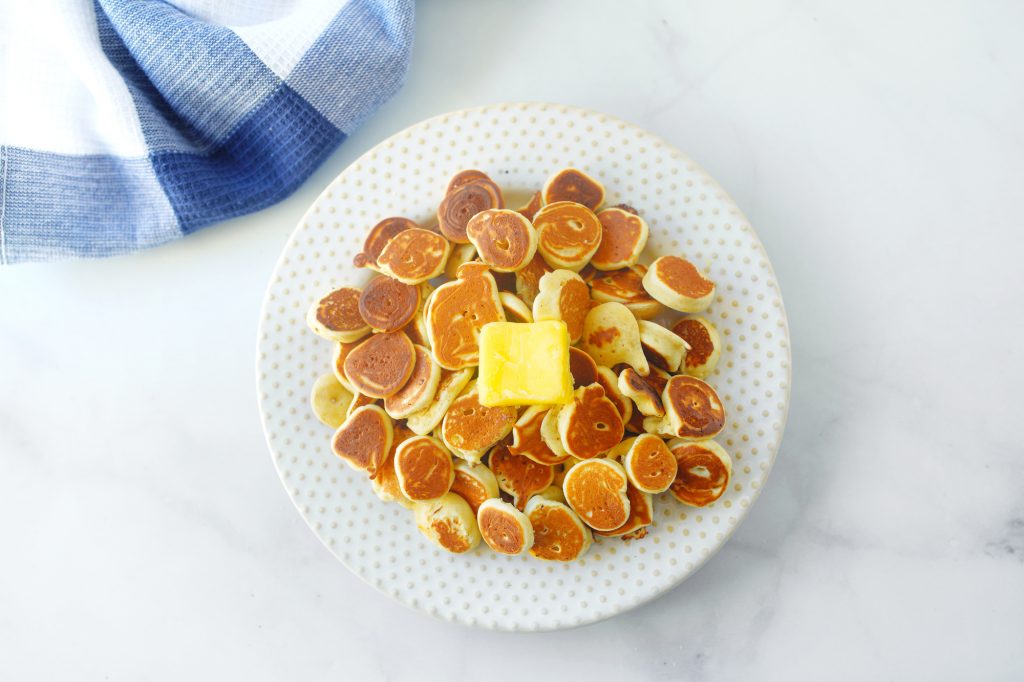 vegan pancake cereal on plate with butter and blue towel