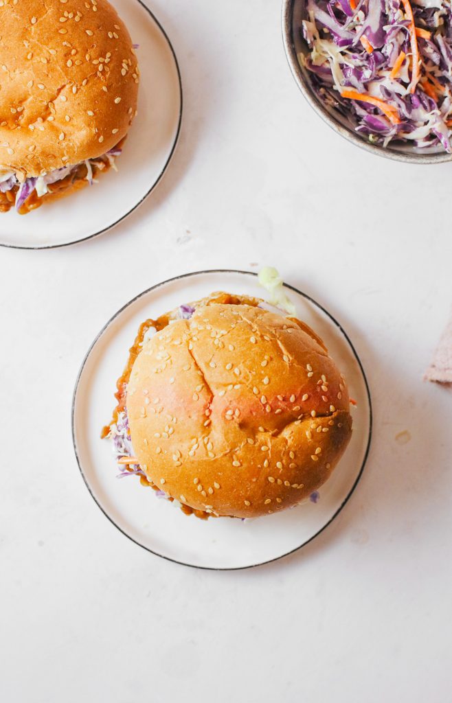 tops of buns with bowl of coleslaw on the side