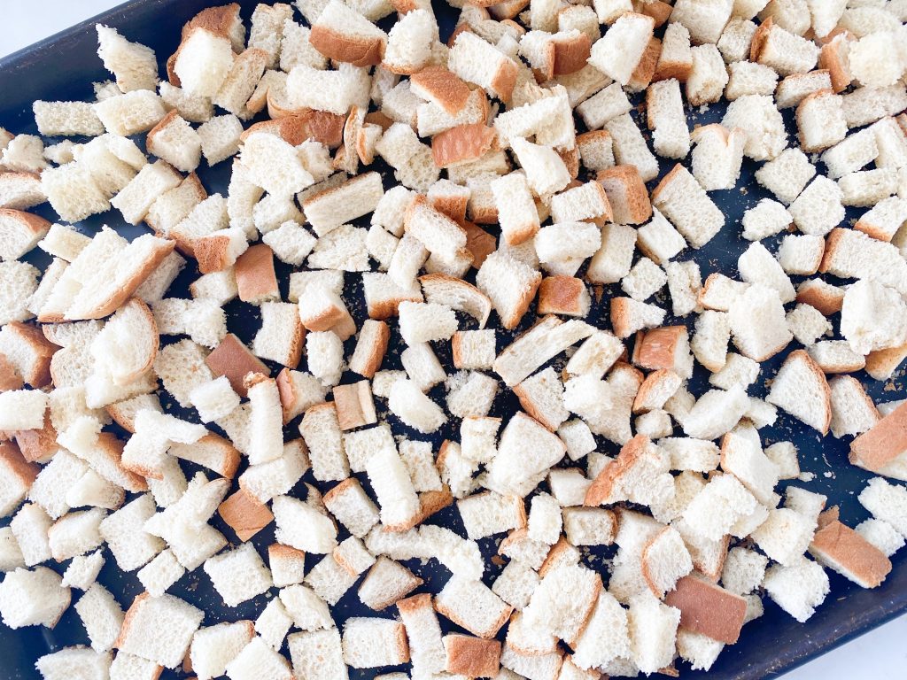 small bread cubes on a tray drying