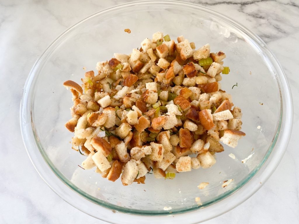 wet vegan stuffing recipe combined in a bowl on a white counter