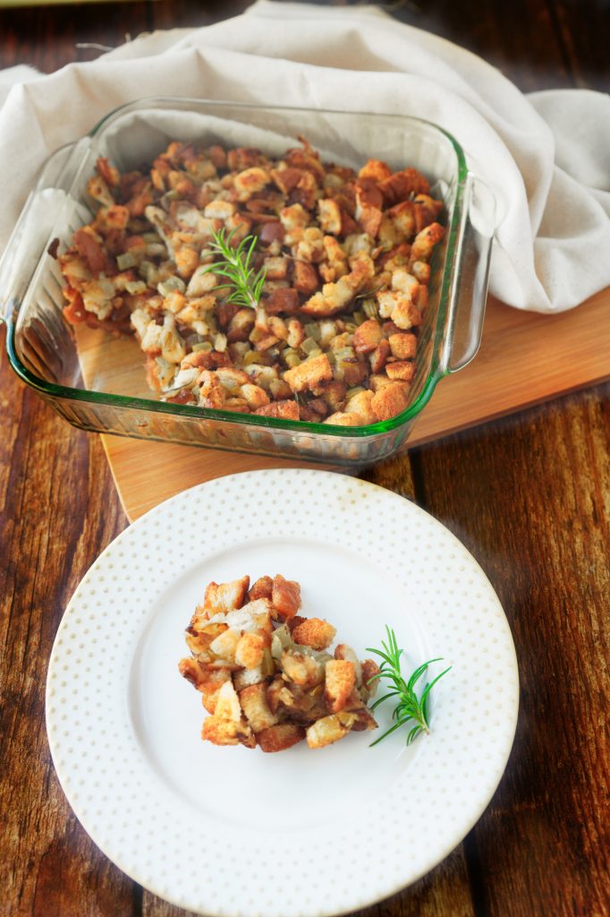 vegetarian stuffing on a plate with stuffing in a serving dish in the background