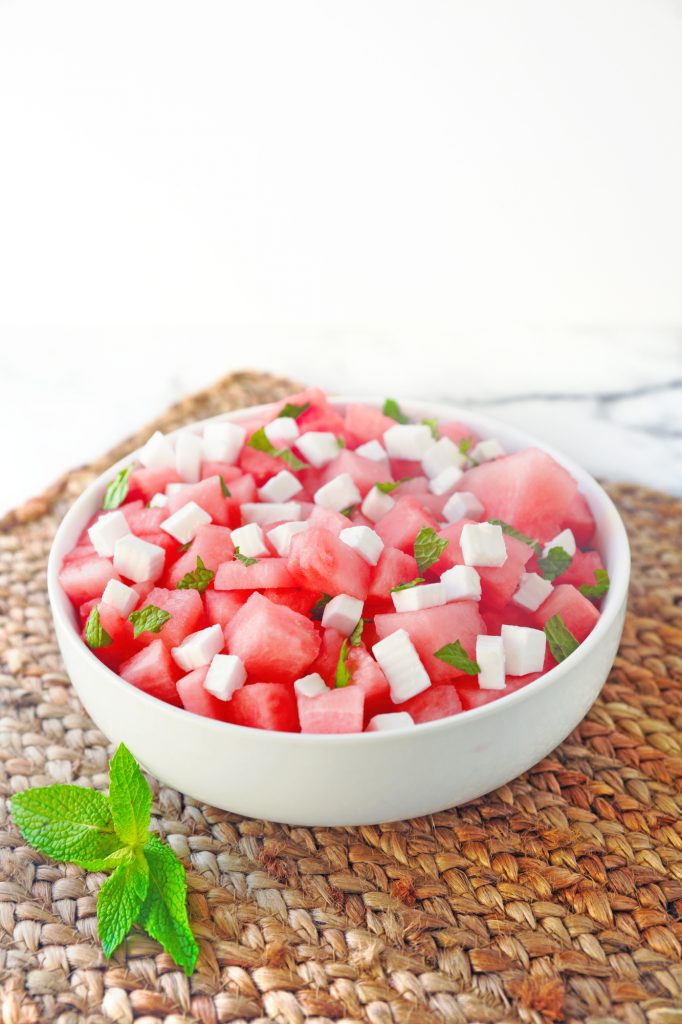 vegan watermelon salad on brown placemat