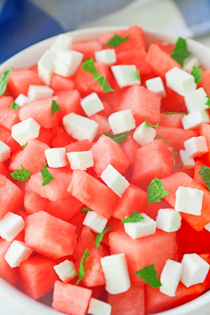 close up of vegan feta on watermelon salad with mint