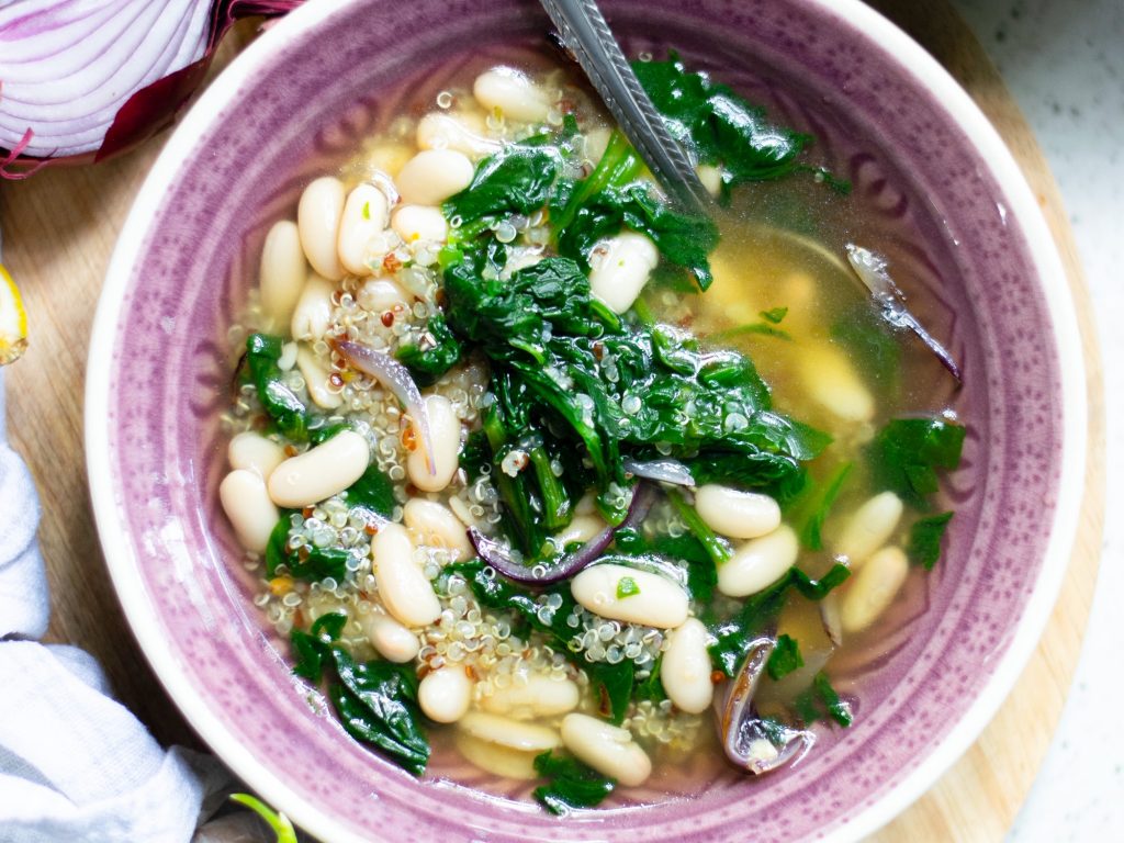 finished vegan white bean soup recipe in pink bowl