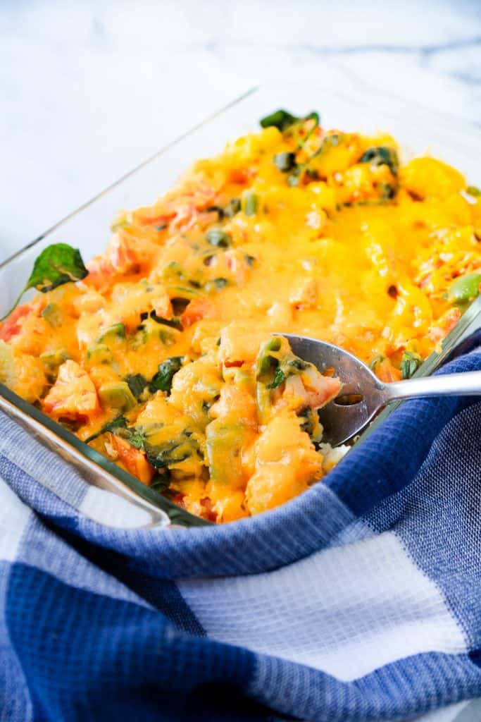 vegetarian breakfast casserole with a scoop being taken out of it