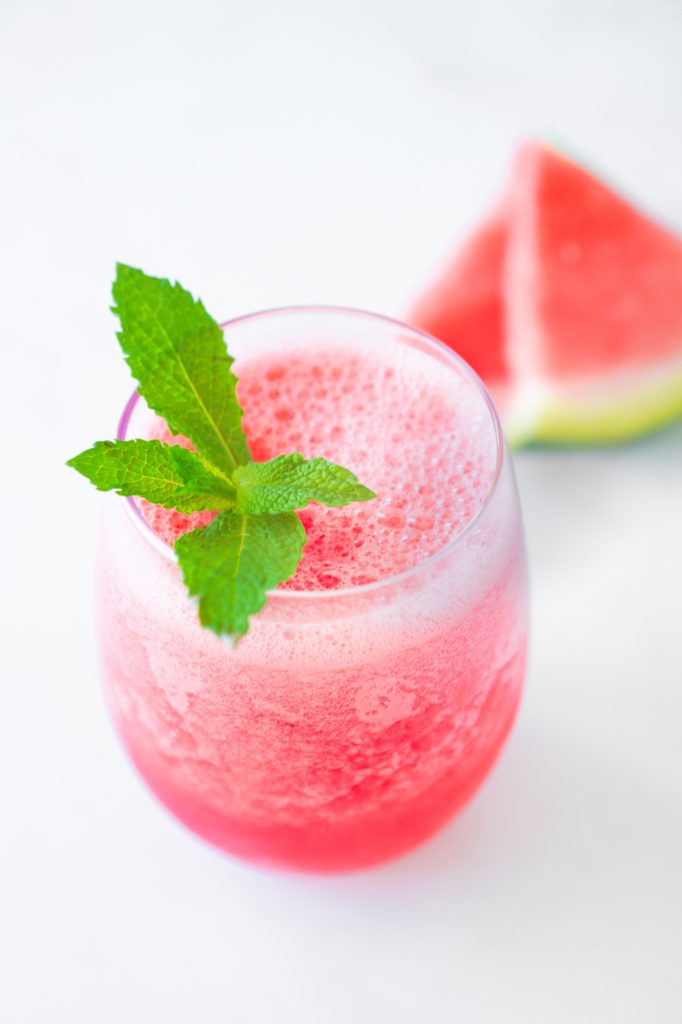 top down shot of watermelon smoothie garnished with mint leaves