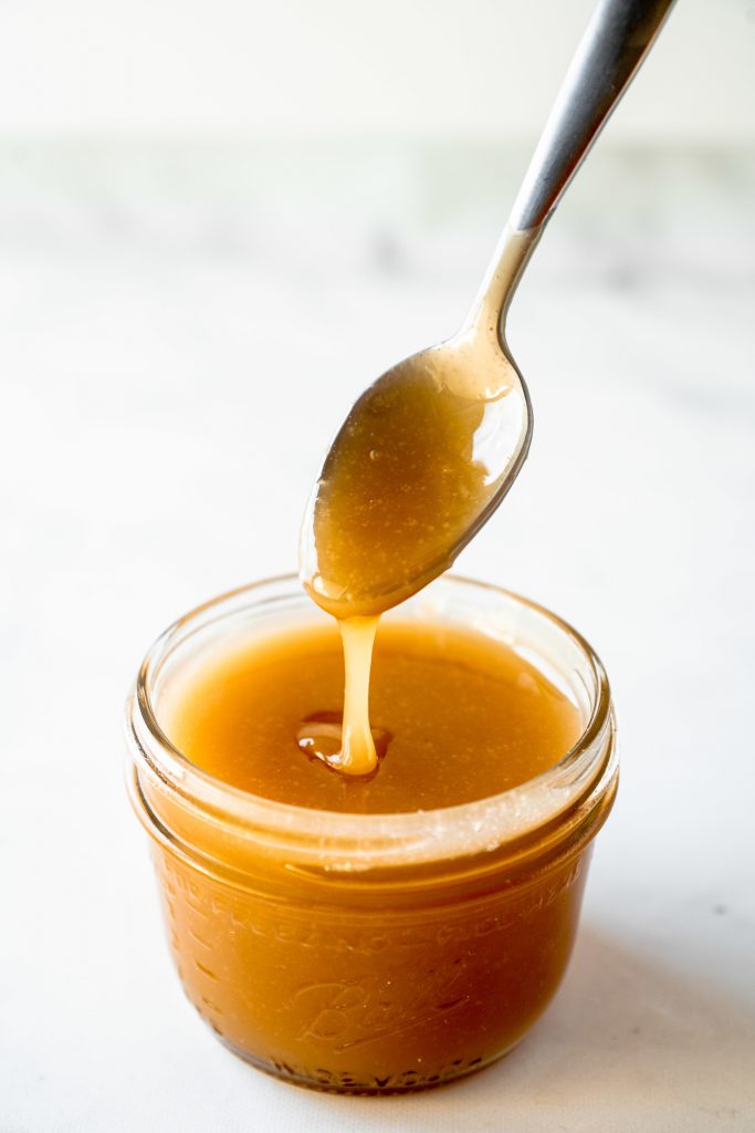 close up of vegan caramel sauce recipe with spoon