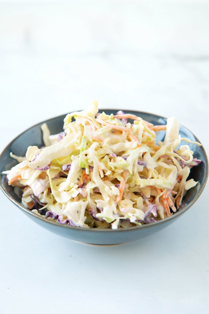 vegan coleslaw recipe in blue bowl